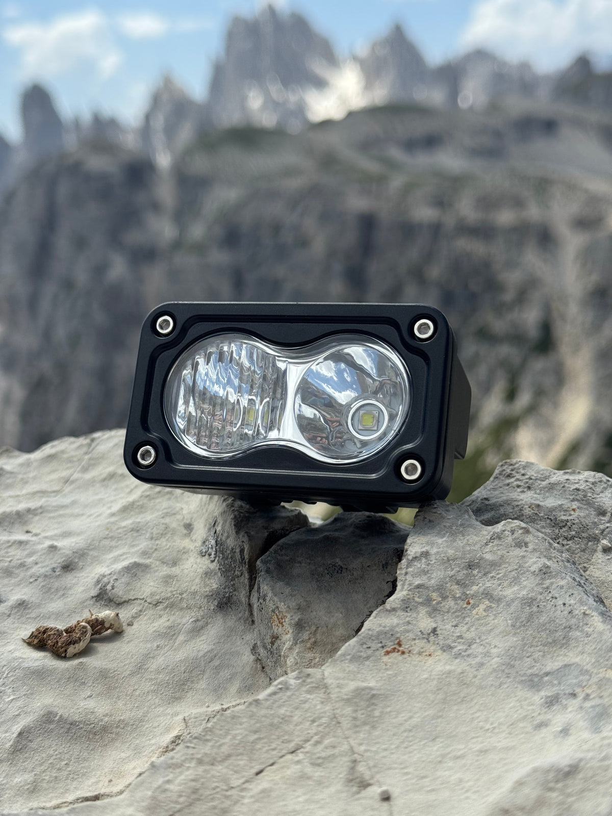 Baja Light on a rock with mountainous landscape in the background