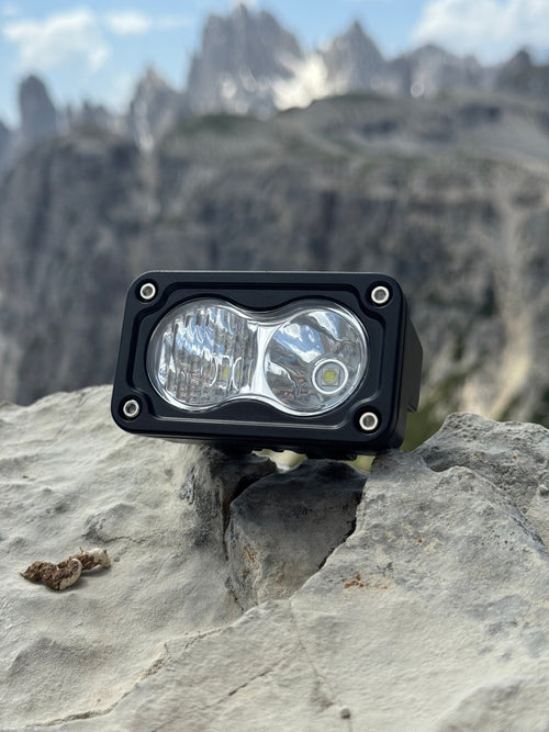 Baja Light on a rock with mountainous landscape in the background